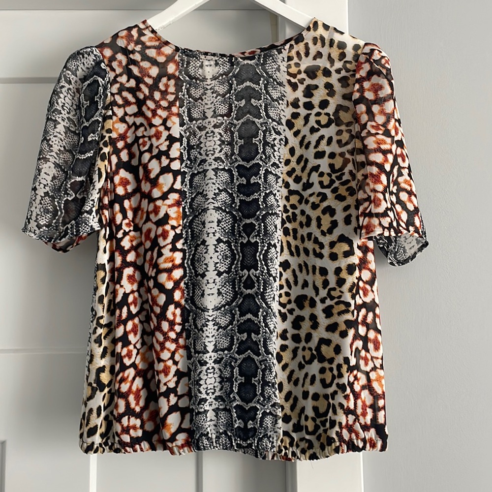 Multi pattern express blouse.   Size M.